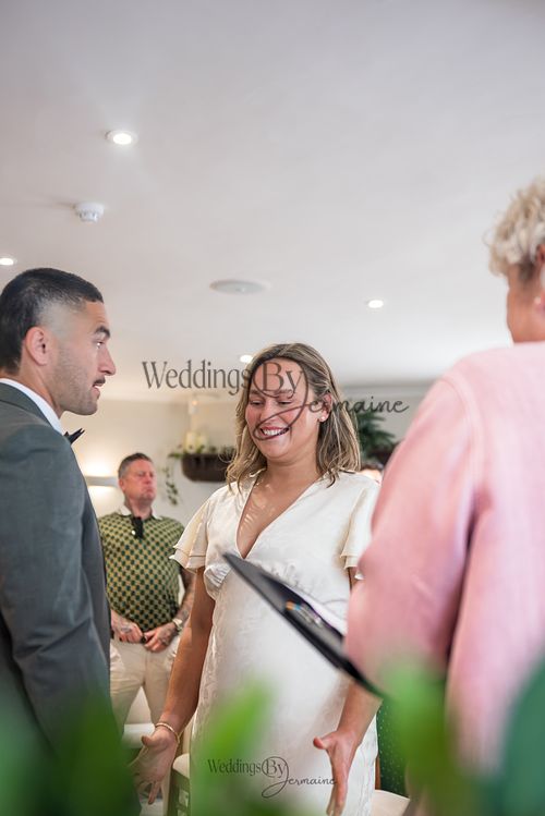 Bride-and-groom-listening-to-officiant-at-Oakham-Registry-Office