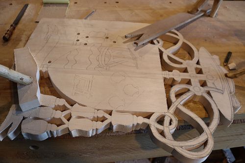 cutting out more of the coat of arms