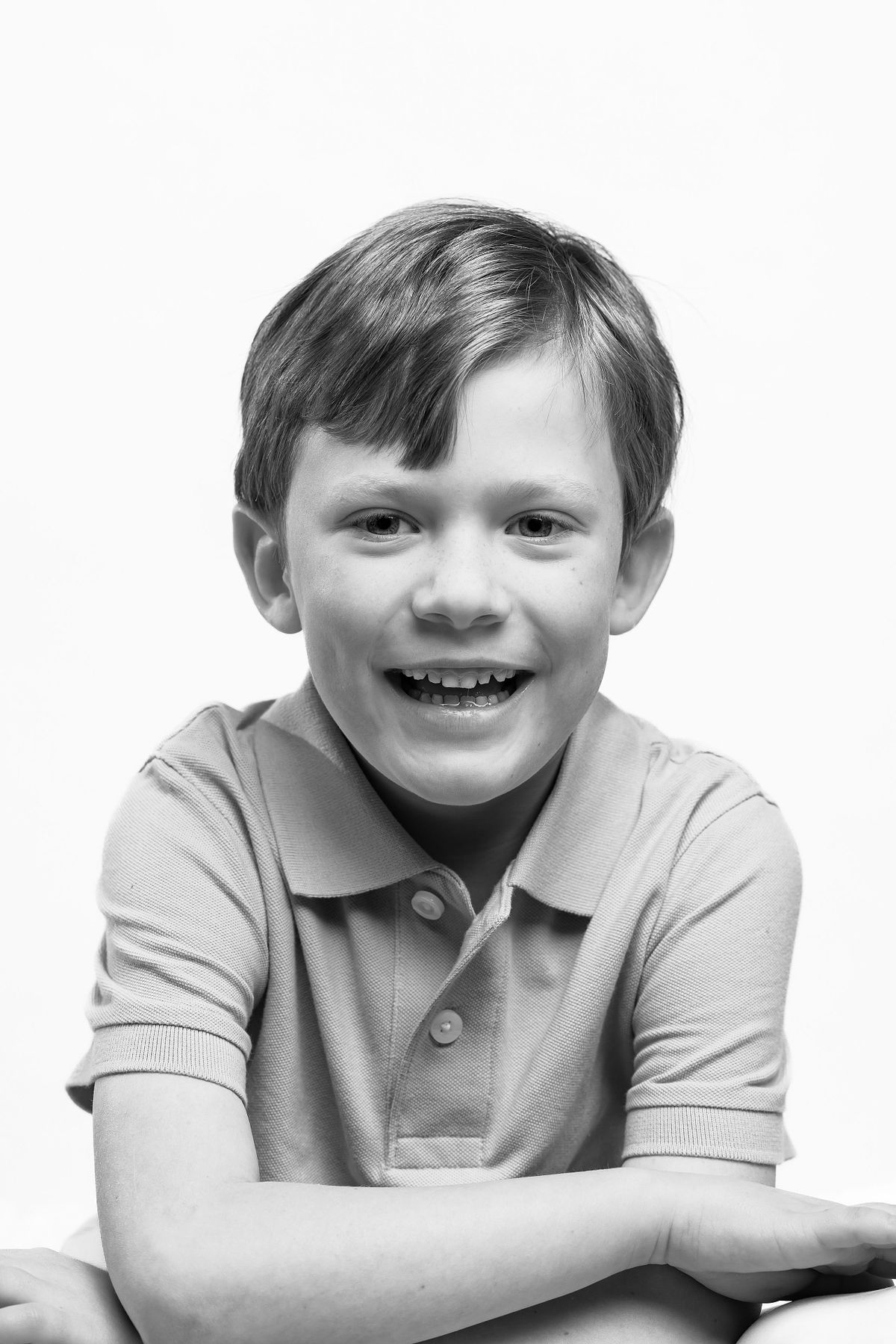 A young boy photographed in black-and-white at a studio in Carrboro, NC