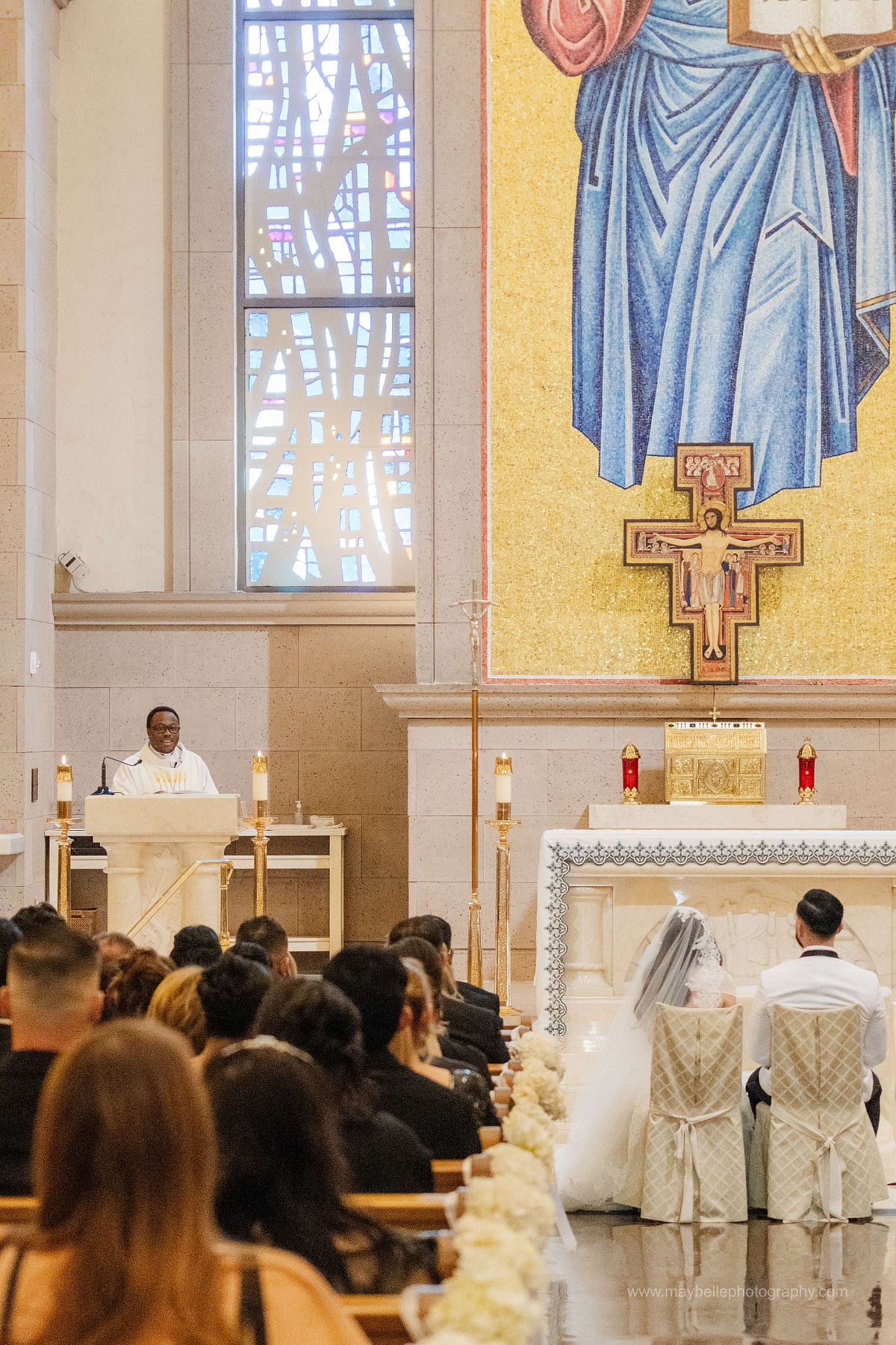 Exchanging vows at Saint Joseph, Husband of Mary Roman Catholic Church in Las Vegas Wedding Photography