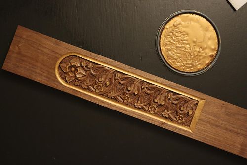 one of the carved stem panels with the gold paint finished