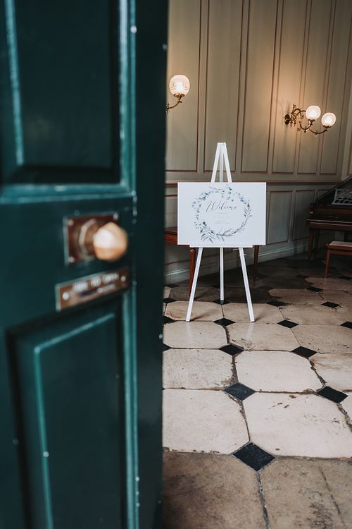 Entrance to wedding venue with welcoming sign
