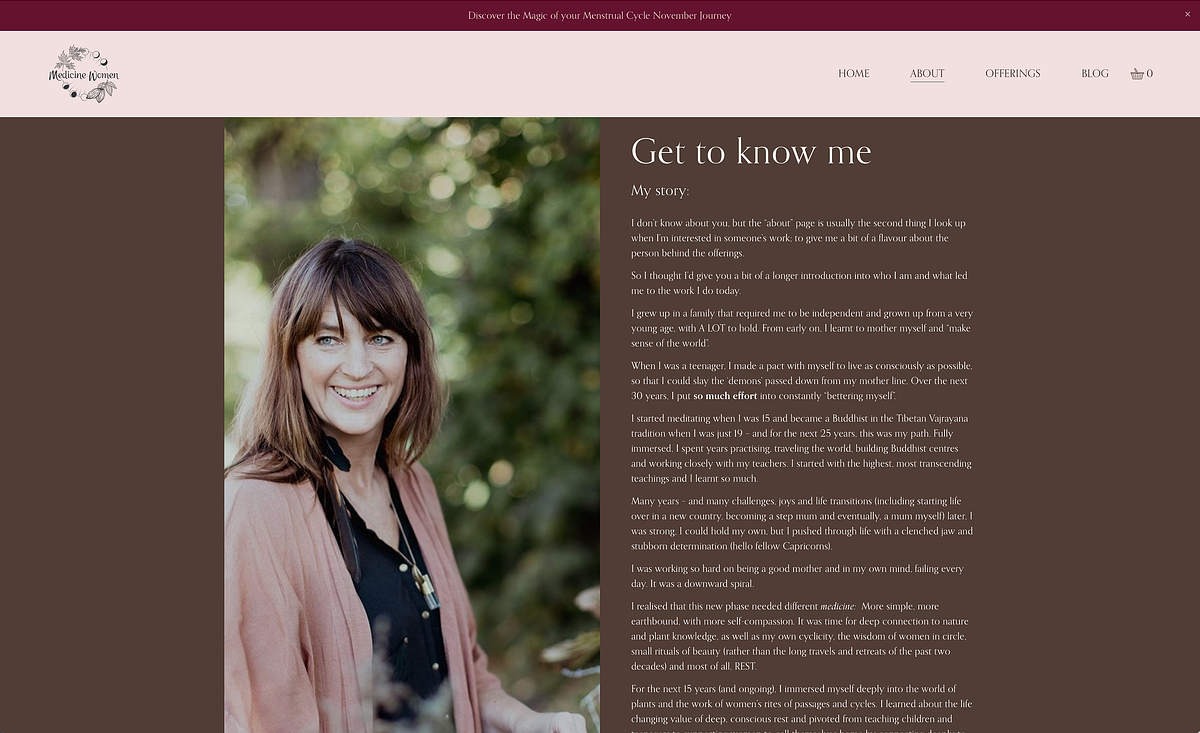 dark haired woman standing in a garden - website about menstrual cycles