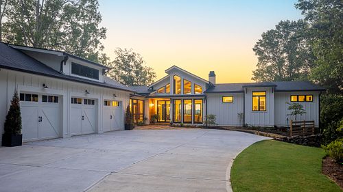 View of the house across the driveway with Dawn light coming over the house