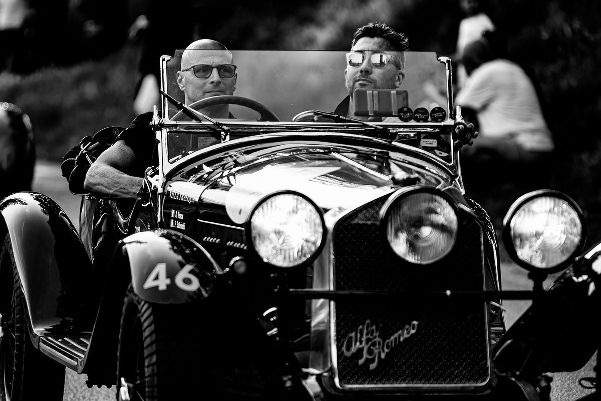 Vintage car with 2 people