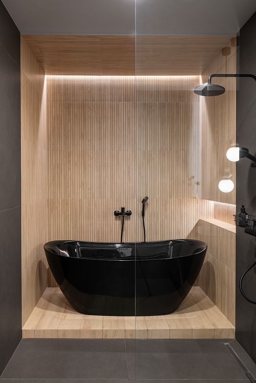 Bathroom with bathtub showcasing soft light and natural textures &ndash; Columna project