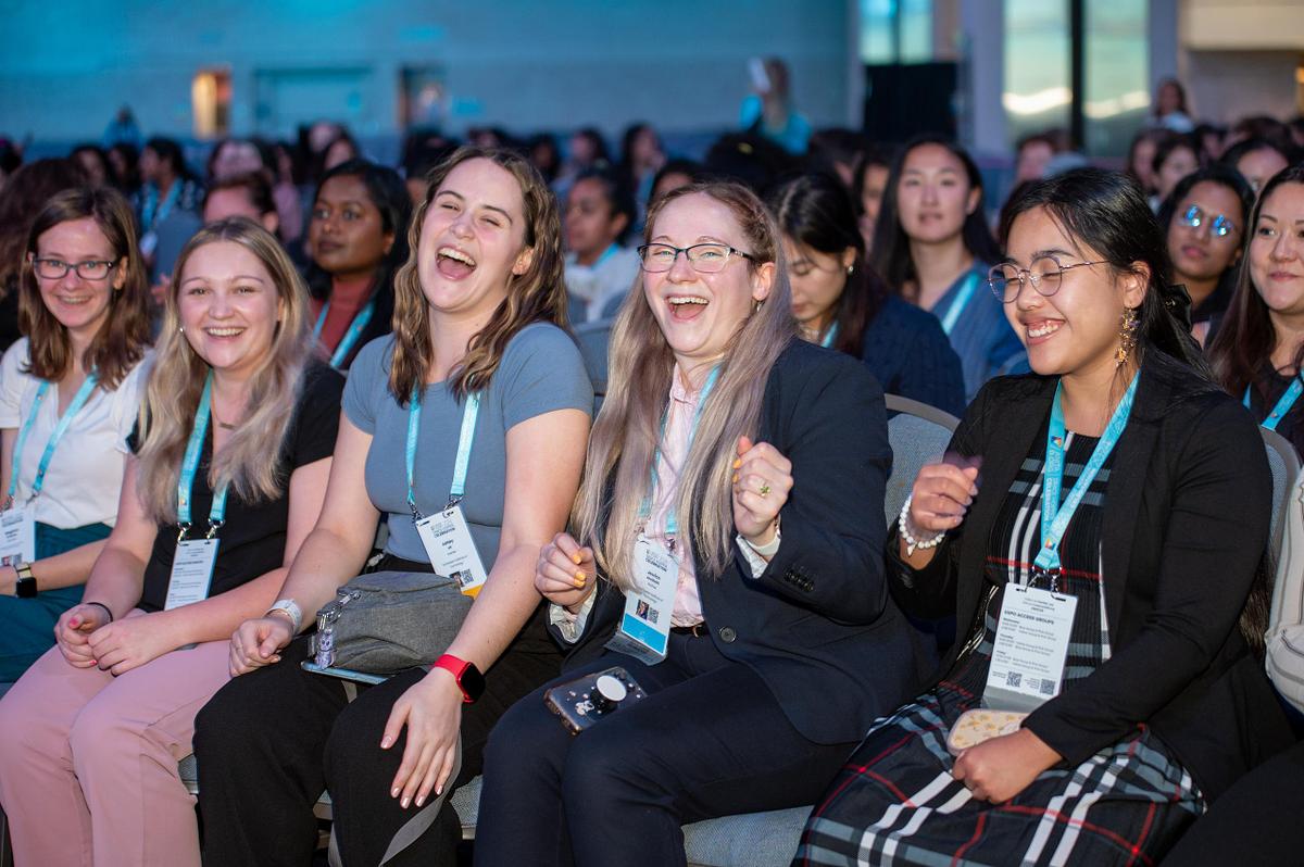 Audience members laughing and reacting during a conference session, capturing authentic engagement and energy at a corporate event in Philadelphia