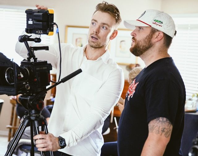 Two photographers having a chat during a photoshoot