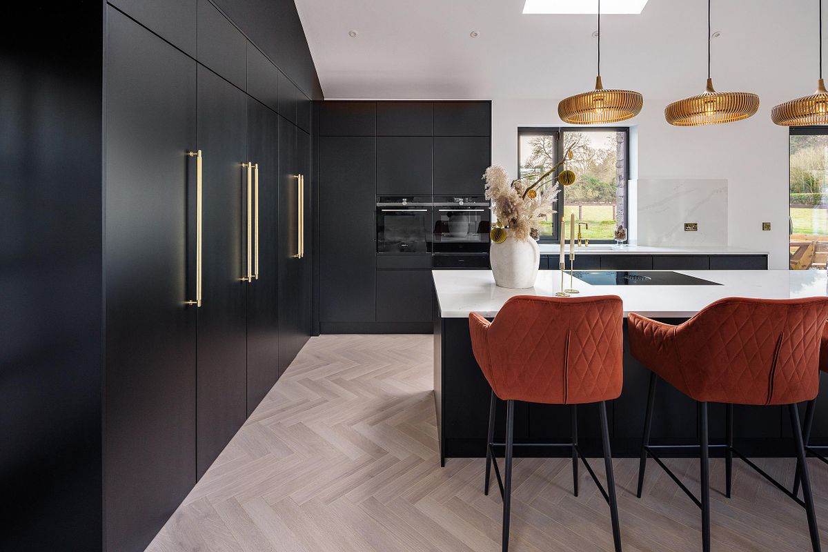 Modern Dark-Themed Kitchen with Feature Lighting