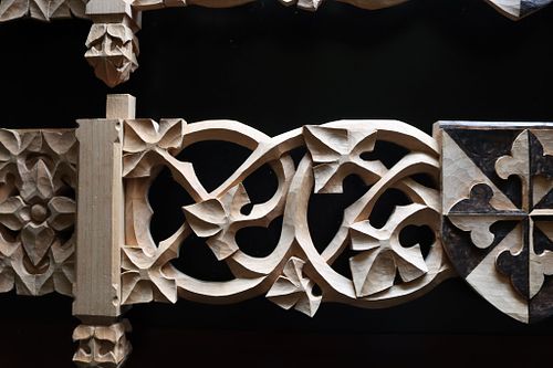 detail of the scrolling vines on the shelf carvings before stain in good light
