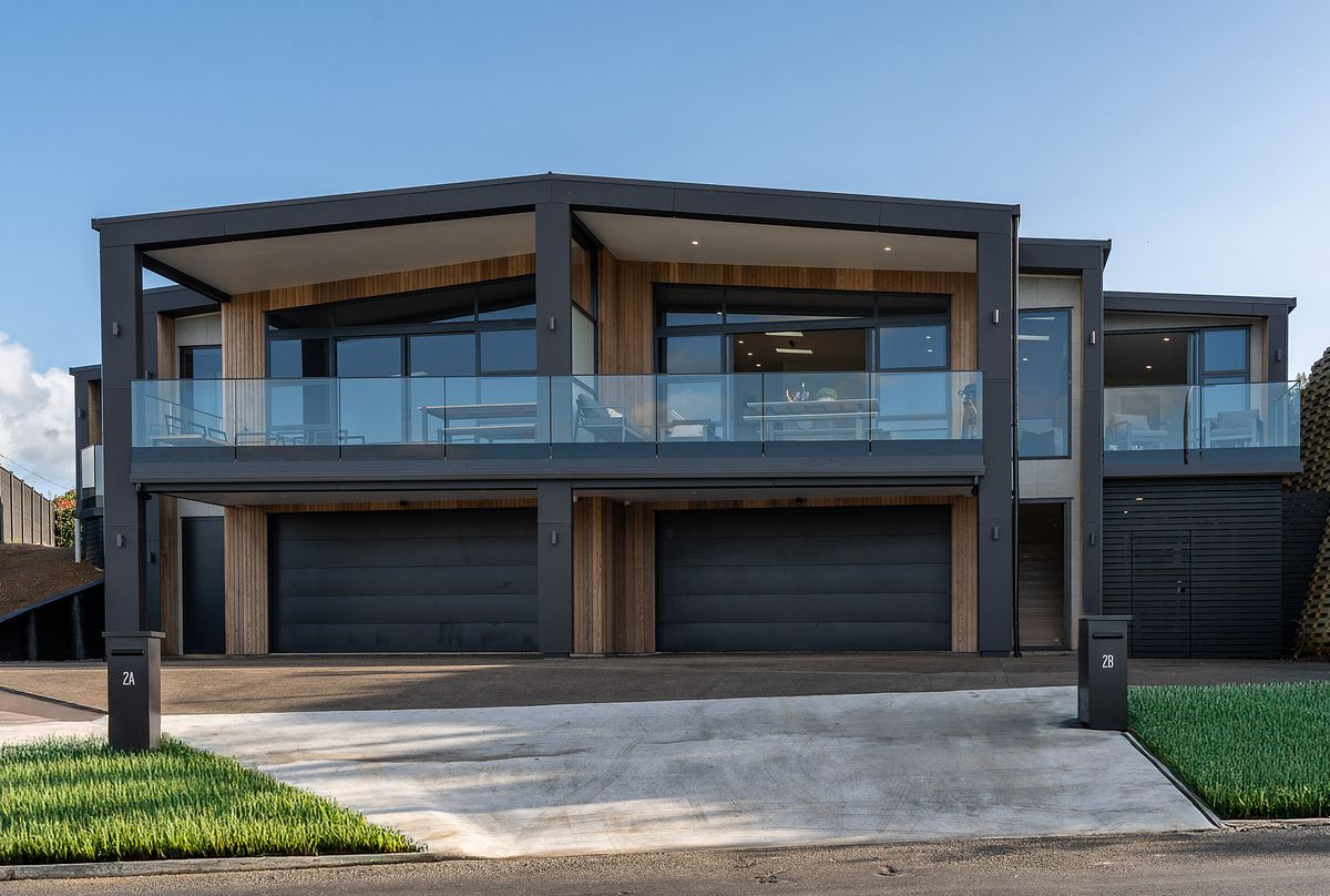 Exterior architectural photography of a modern two-story residence in Raglan by Flax Cove Studio.
