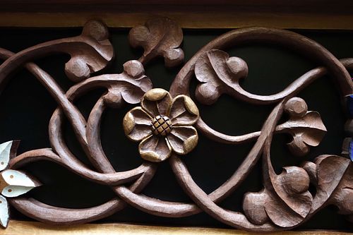 hand-carved wild rose with gold paint