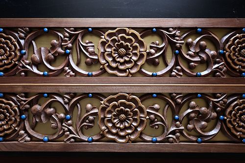 hand-carved rose and vine panel with liturgical gold background