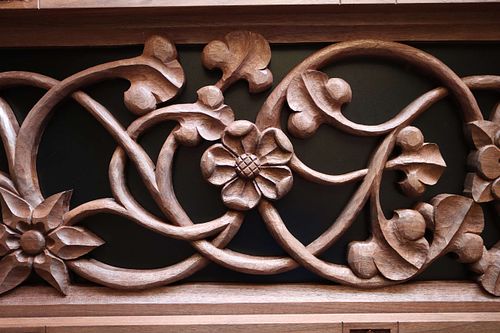 hand-carved wild rose in walnut