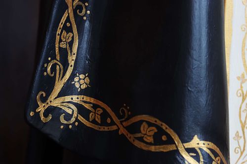 Detail of the custom gold trim on St Rose's cloak