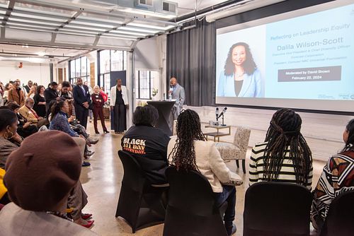 Community members participating in a leadership fireside chat with Dalila Wilson-Scott, Executive VP and Chief Diversity Officer at Comcast Corporation, discussing equity, civic responsibility, and corporate impact, in partnership with the Urban League in Philadelphia, captured by professional event photographer.