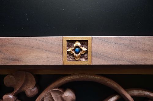 hand-carved and polychrome painted small virgin's bower flower in door panel frame