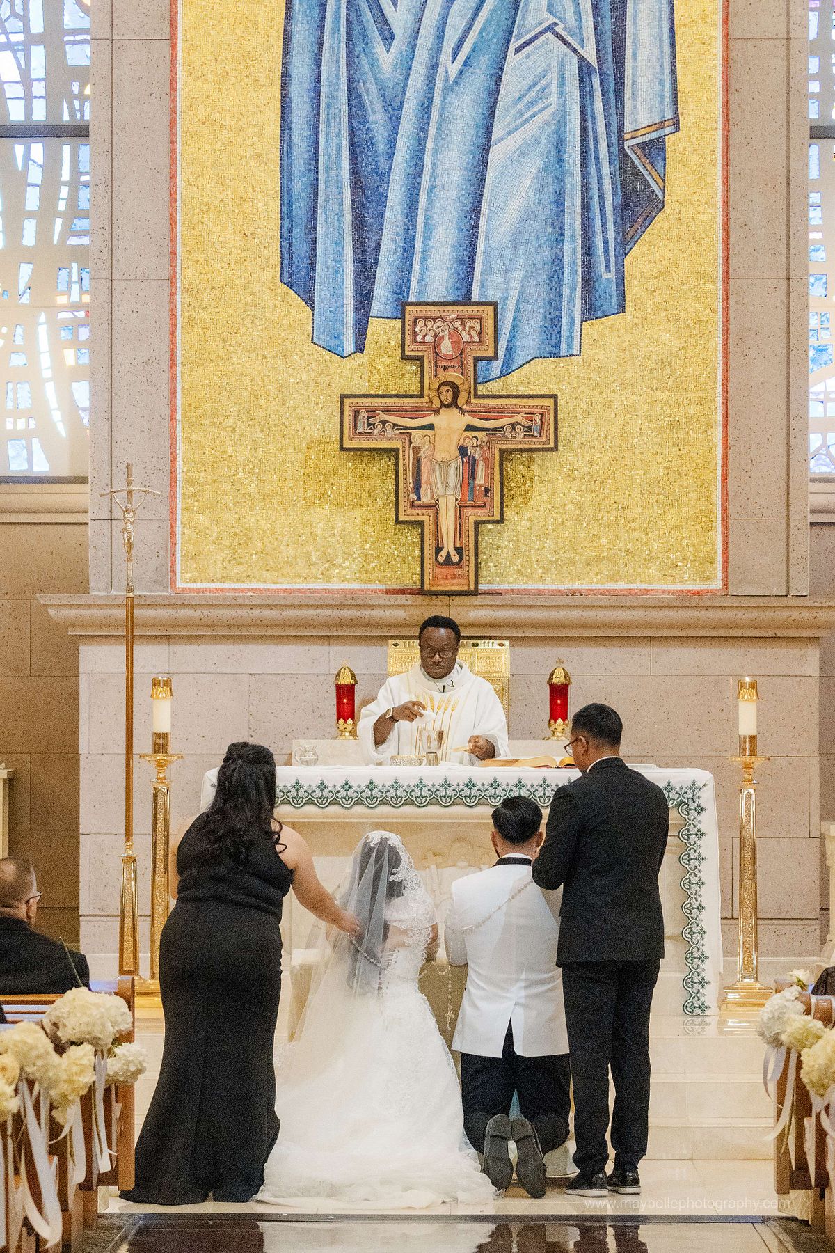 Exchanging vows at Saint Joseph, Husband of Mary Roman Catholic Church in Las Vegas Wedding Photography