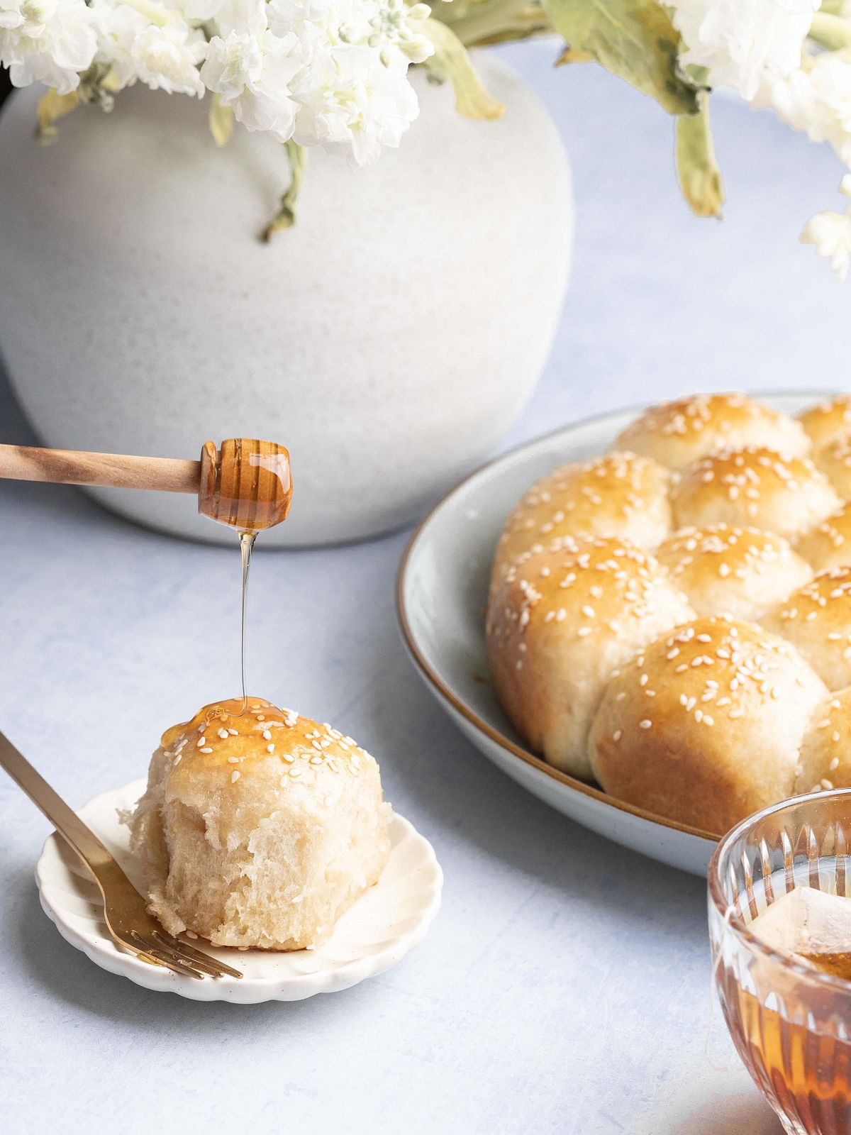 Drizzling of honey onto a cream cheese roll