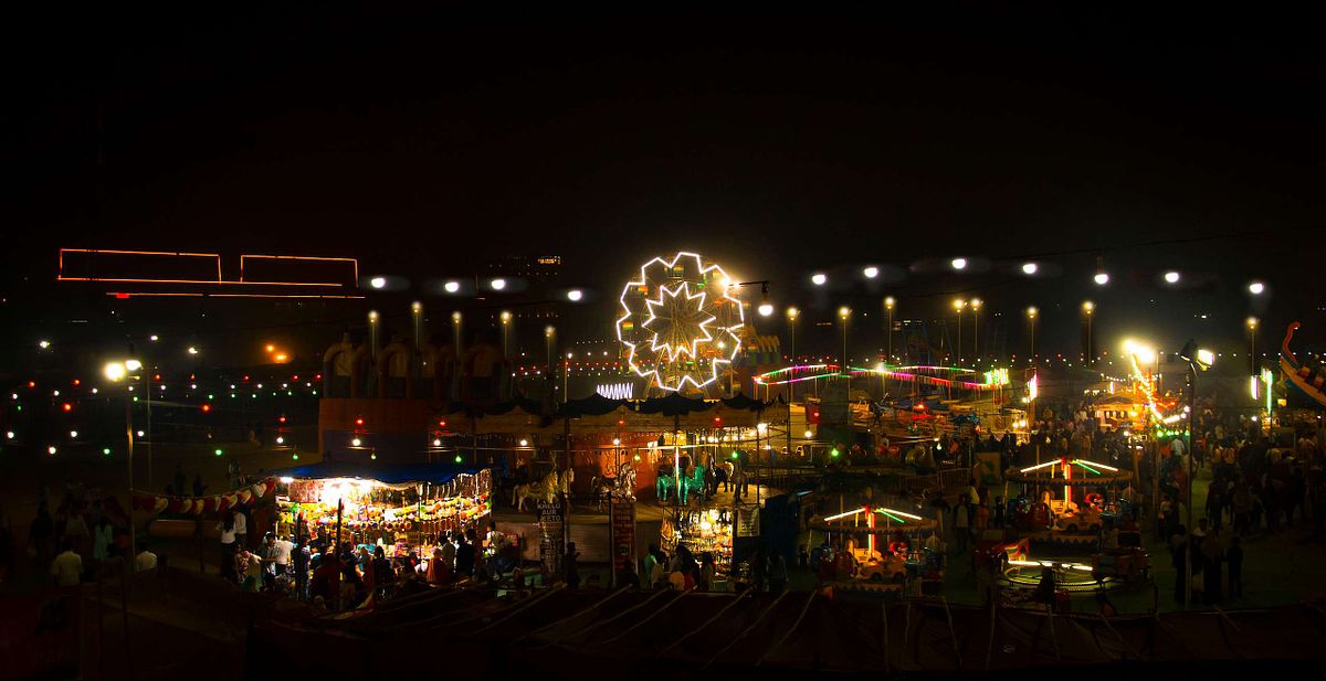 night photography. crowd, people, fair, celebration,