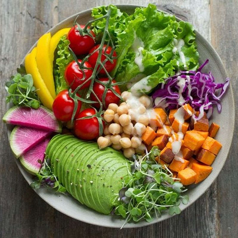 Colorful salad bowl with protein for menopause, fresh vegetables and greens