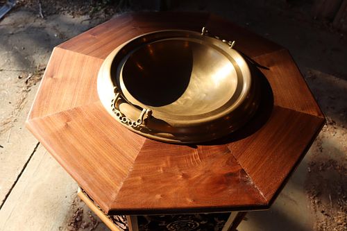 a detail showing the beautiful walnut figure on the top of the font.