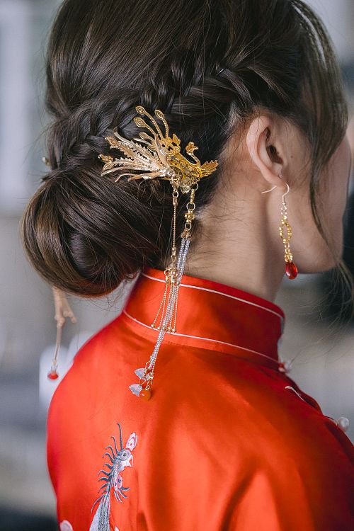 Chinese bride getting ready for traditional tea ceremony