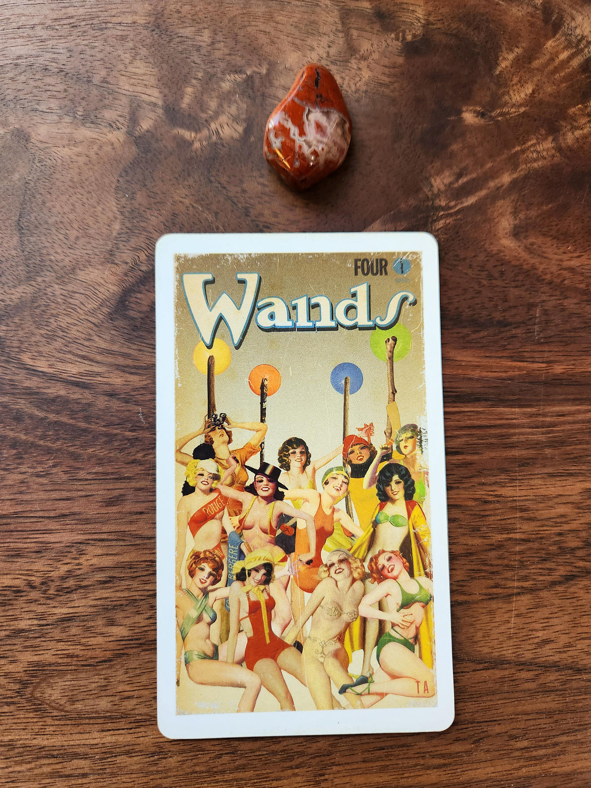 Four of Wands Tarot card and a brecciated jasper crystal