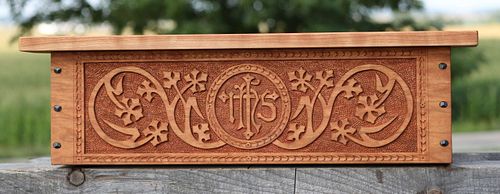 Custom carved cherry shelf for a statue of the Sacred Heart of Jesus