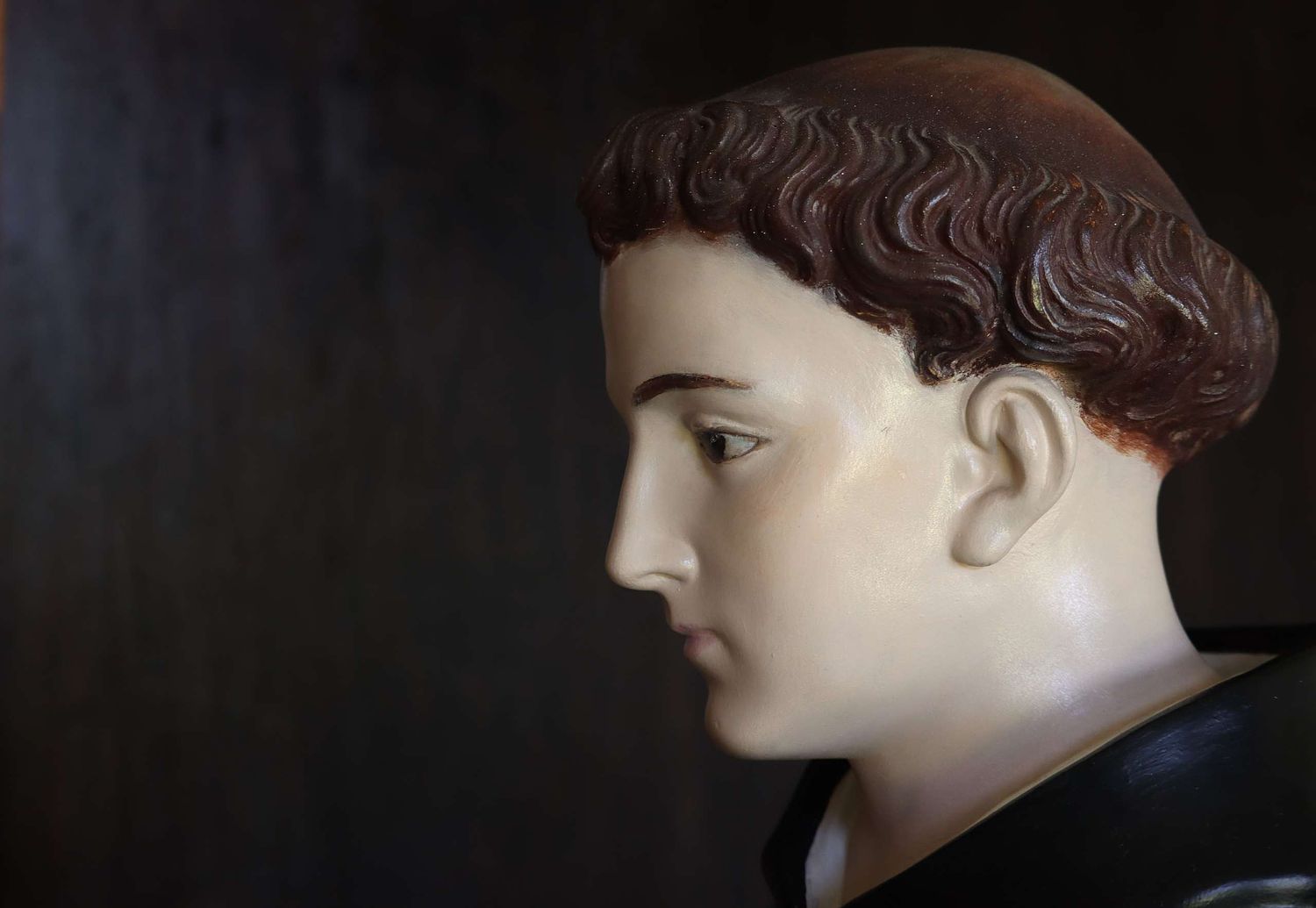 Close up profile photo of the statue before restoration