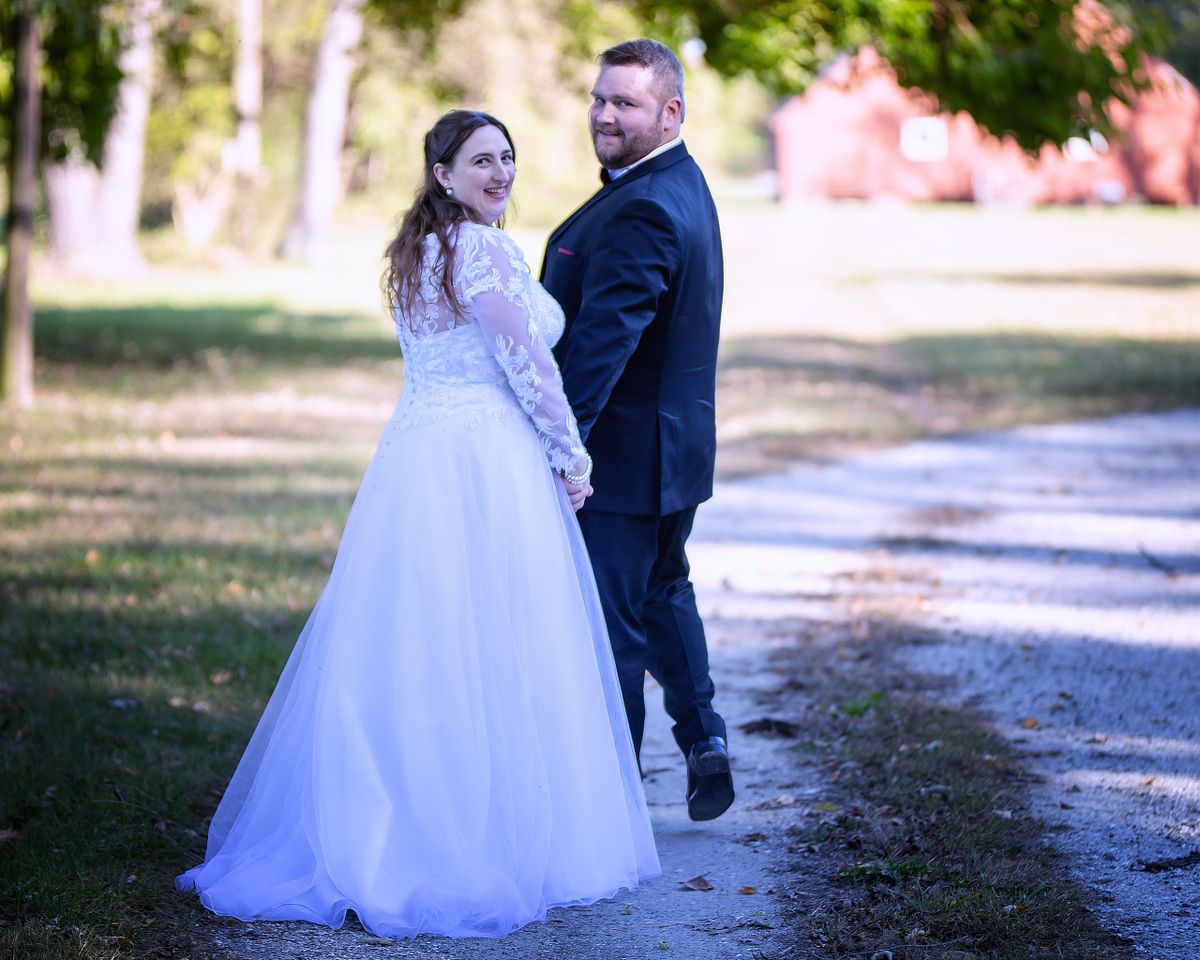 bride and groom walking on the grounds of the historic ross mansion