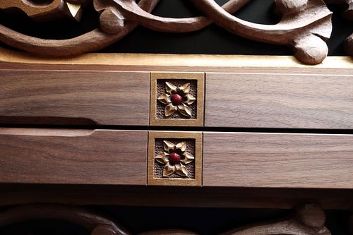 Detail of small Star of Bethlehem flowers that are carved into the border of the door panels