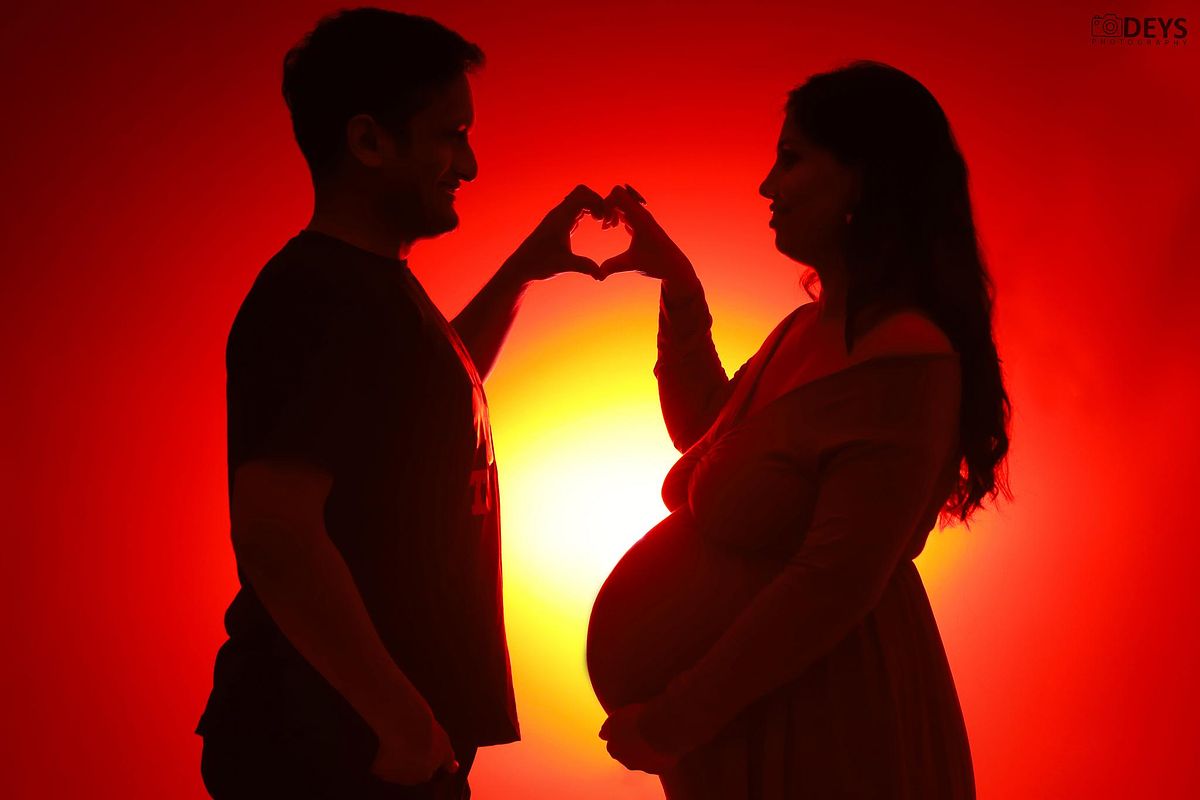 Silhouette couple maternity shoot at home in Meerut