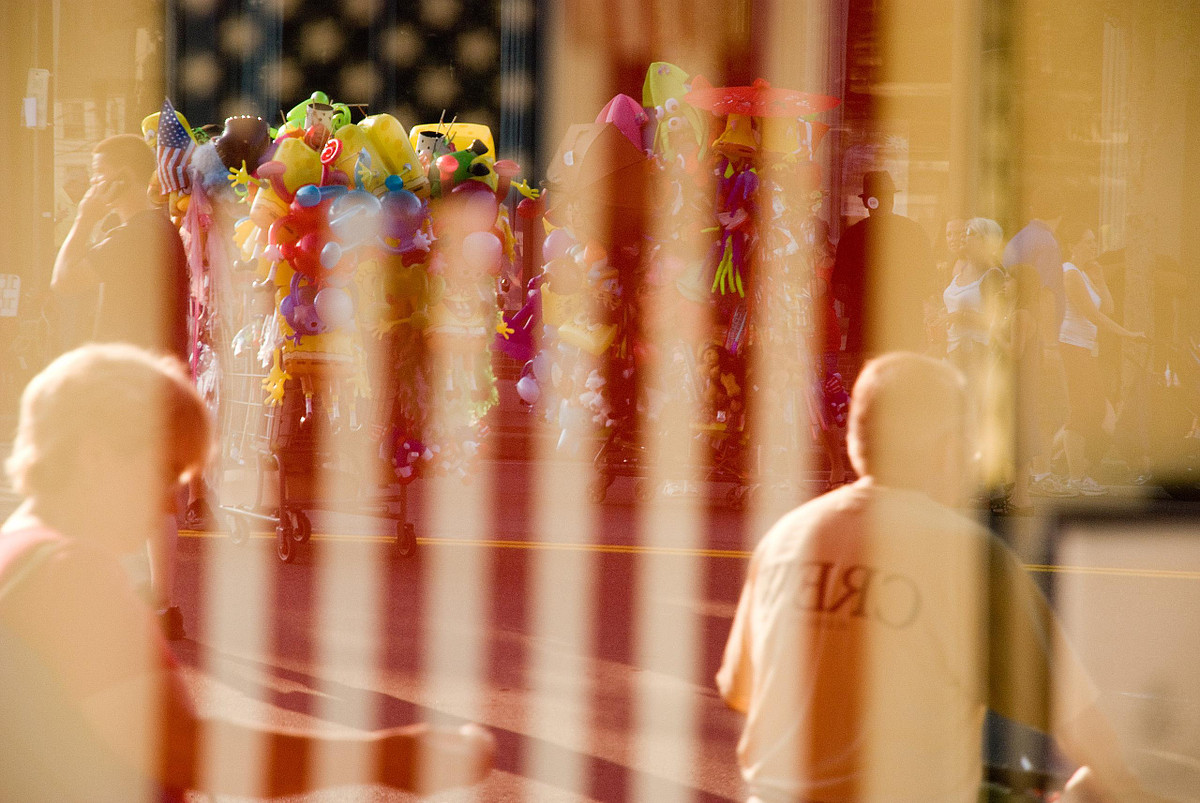 A reflection of street carts filled with merchandise