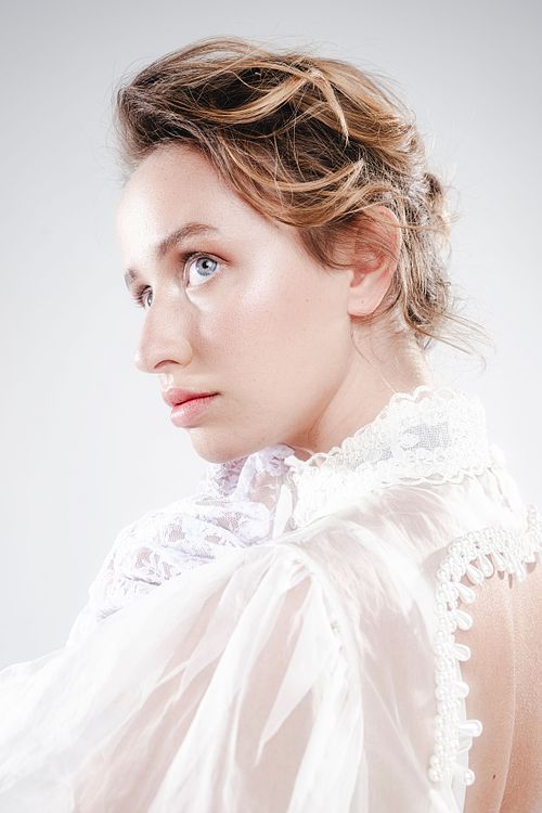 High-fashion pose with elegant stylin, studio photography by Mila Filippone.