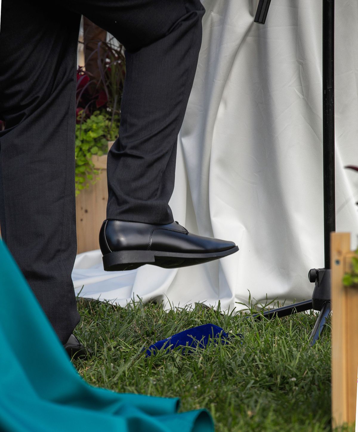 Groom breaking the glass at wedding