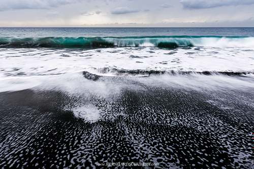 Blacksand beach waves