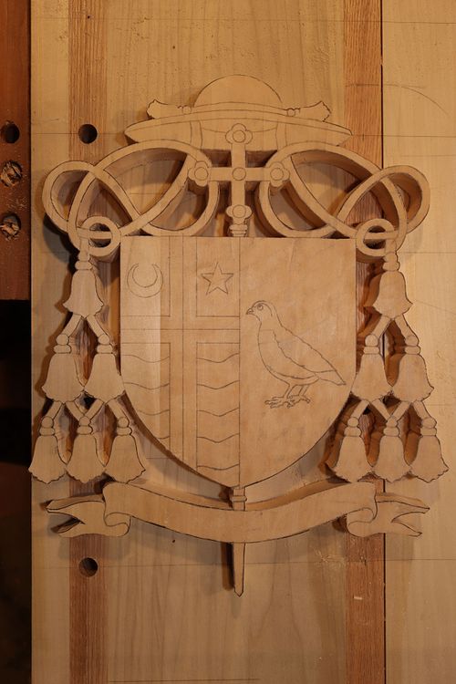 custom wood carved coat of arms for Bishop McKnight in Jefferson City, Missouri