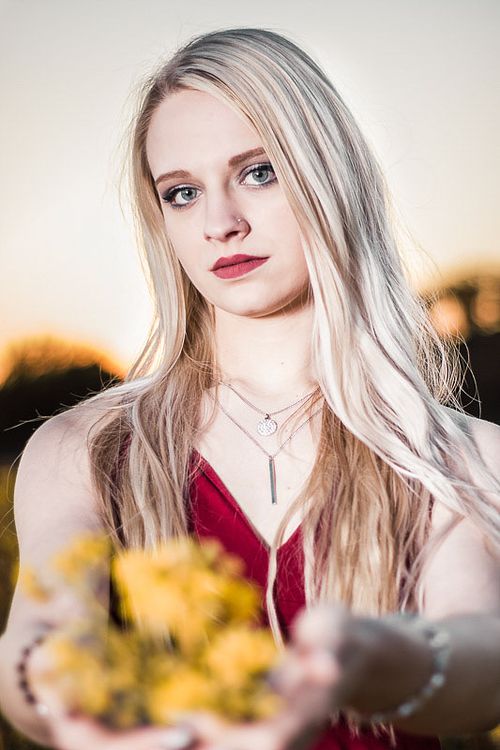 Commercial fashion portrait featuring hard light and shadow play