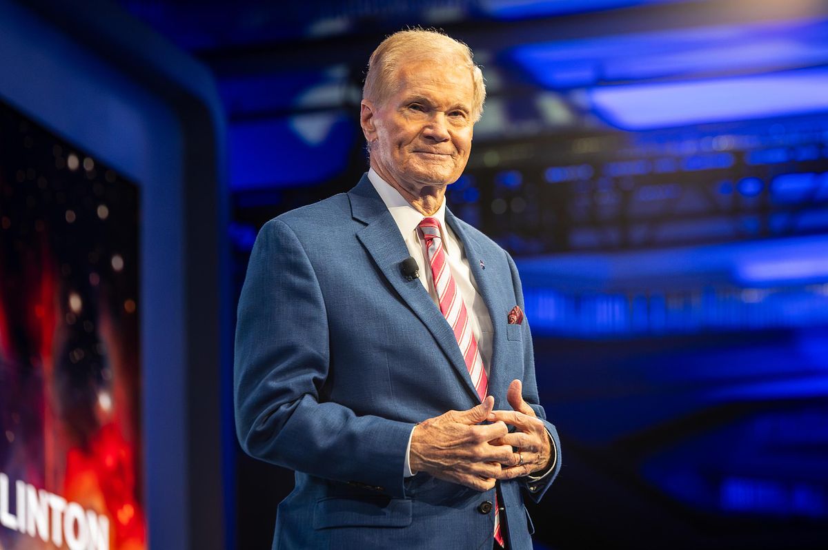 NASA Administrator Bill Nelson delivers remarks on stage at a global leadership event, illustrating executive presence, authority, and strategic communication in a high-profile conference setting.