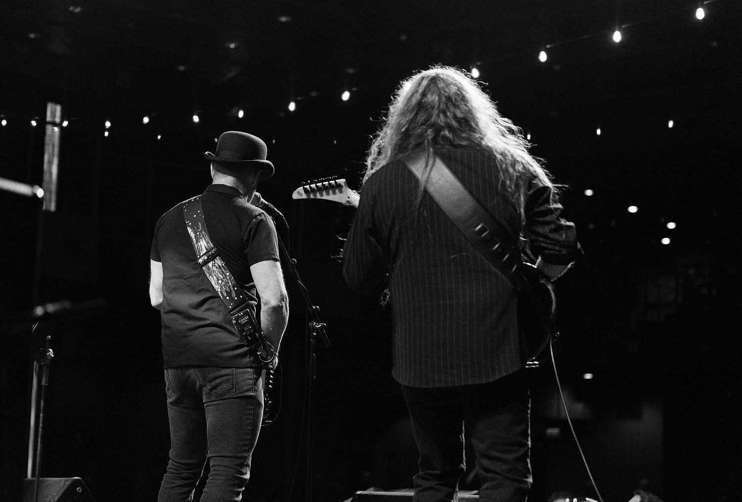 Behind the scenes stage shot of two members from Crash Alley