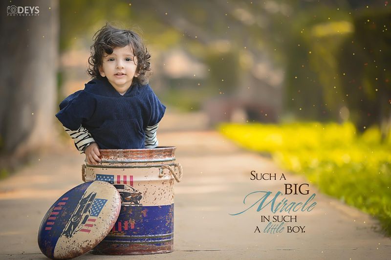 How do I get my 2-year-old to pose for pictures?