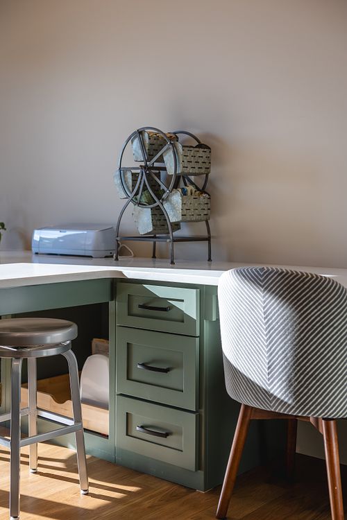 Built-in desk and craft table in craft room