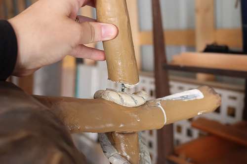 Broken Cross plaster statue repair