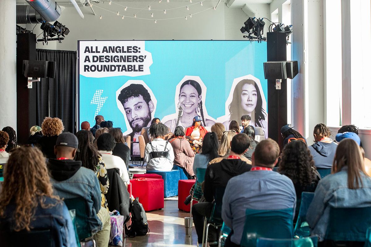 Corporate event photography capturing creative leaders speaking during the “All Angles: A Designers’ Roundtable” session at B.PHL Fest 2023 in Philadelphia, highlighting innovation, storytelling, and collaboration in design.
