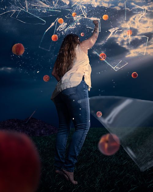 A woman reaching for peaches amongst a shattered blue sky.