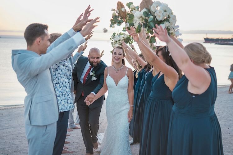Bride and Groom welcome by bridesmaid