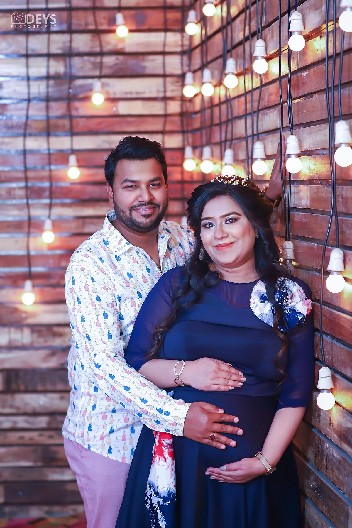 Pregnancy photoshoot with husband in theme studio in Meerut