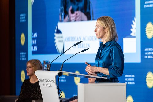 Kaja Kallas delivering a speech on stage during a gala dinner at the Axica Convention Centre.