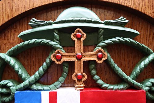 galero and cross on Bishop McKnight's coat of arms